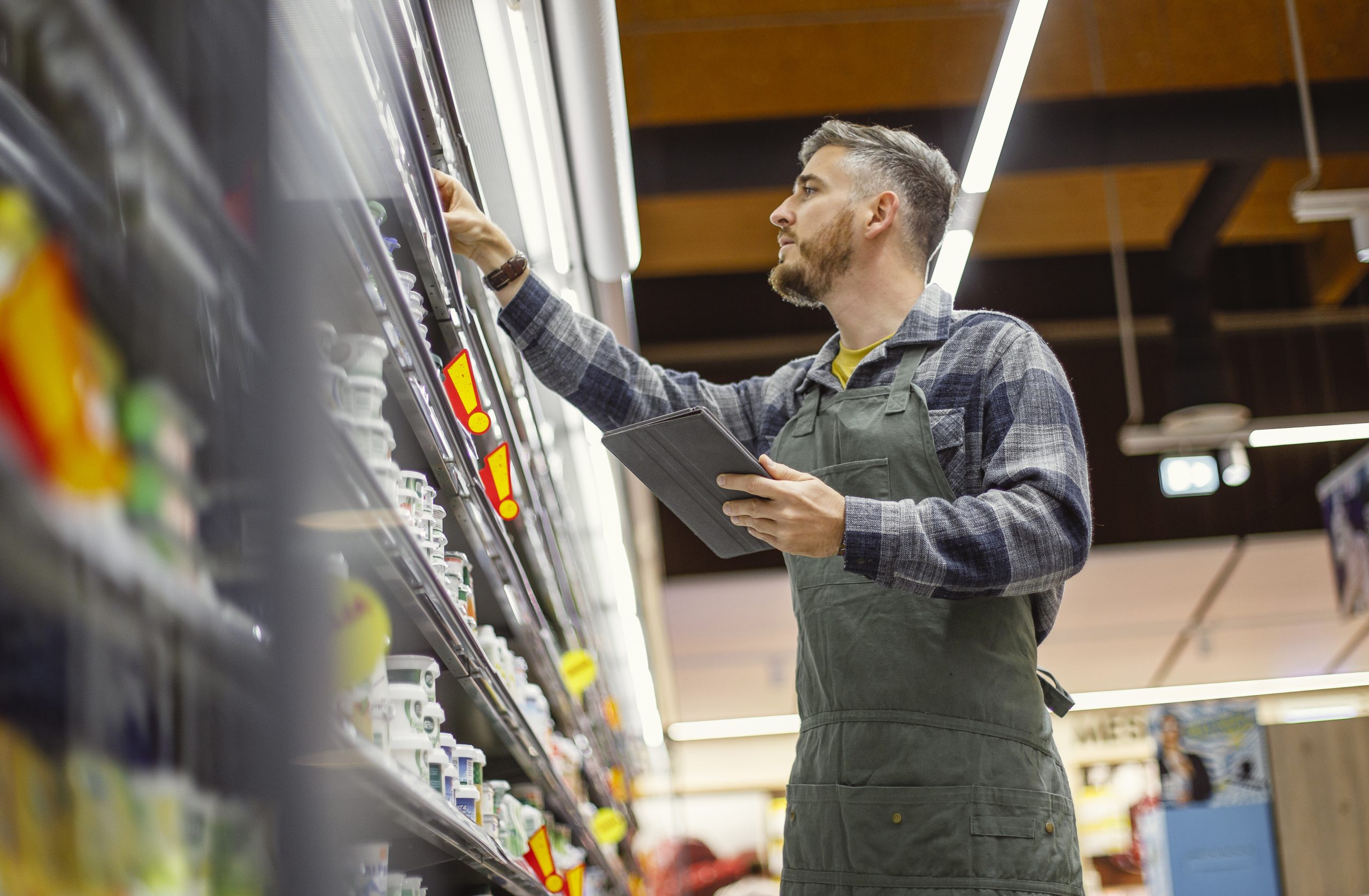 Retail Employee Organizing Store Shelves